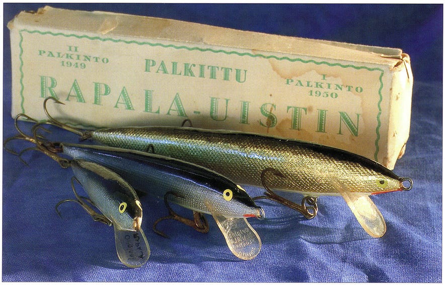 A 5 old wooden fishing lure pike minnow with glass eyes made by Creek Chub  Bait Company and does have some paint wear.